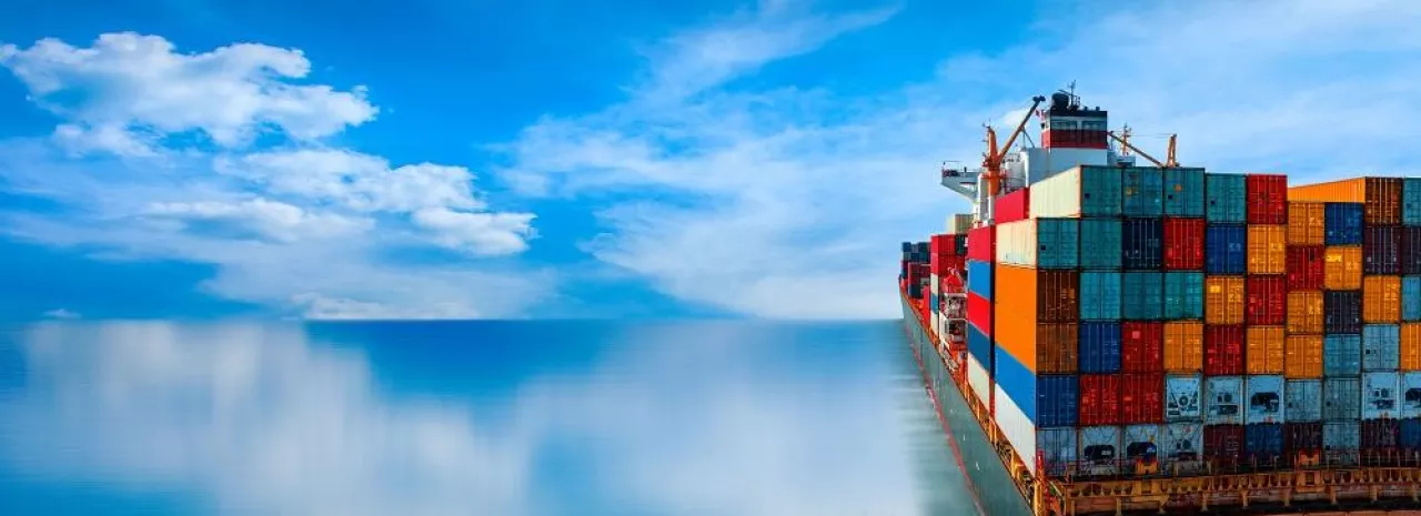 Stern of large cargo ship import export container box on the ocean sea on blue sky back ground concept transportation logistic and service to customer and supply change